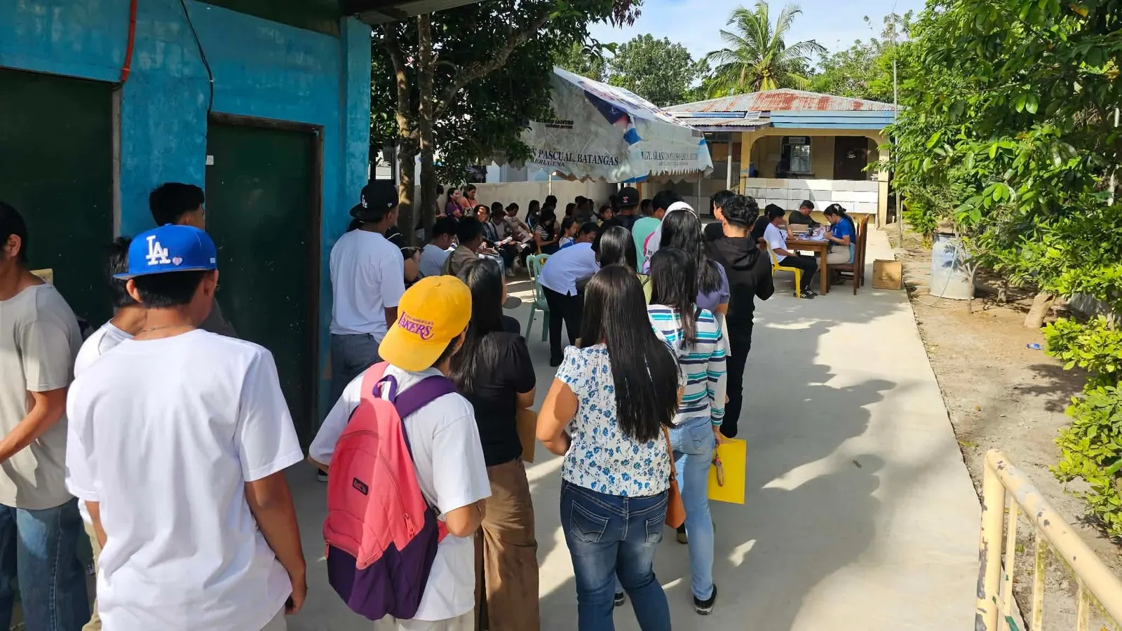 Applicants lined up outside a local recruitment activity